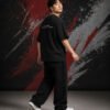 Karma Quote Graphic T-Shirt (Oversized) side Karma Quote Graphic T-Shirt (Oversized) side view worn by model